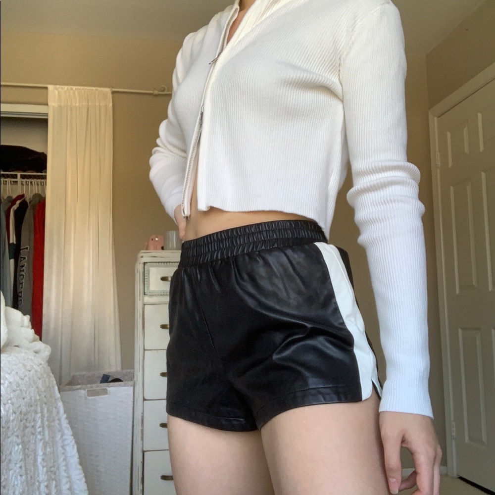 Black fake leather shorts with white stripes